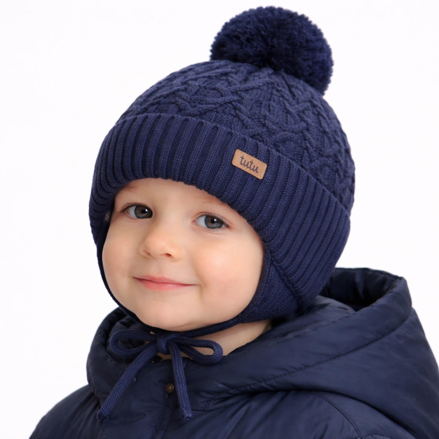 Seravo boy tie-on cable-knit merino earflap cap wi